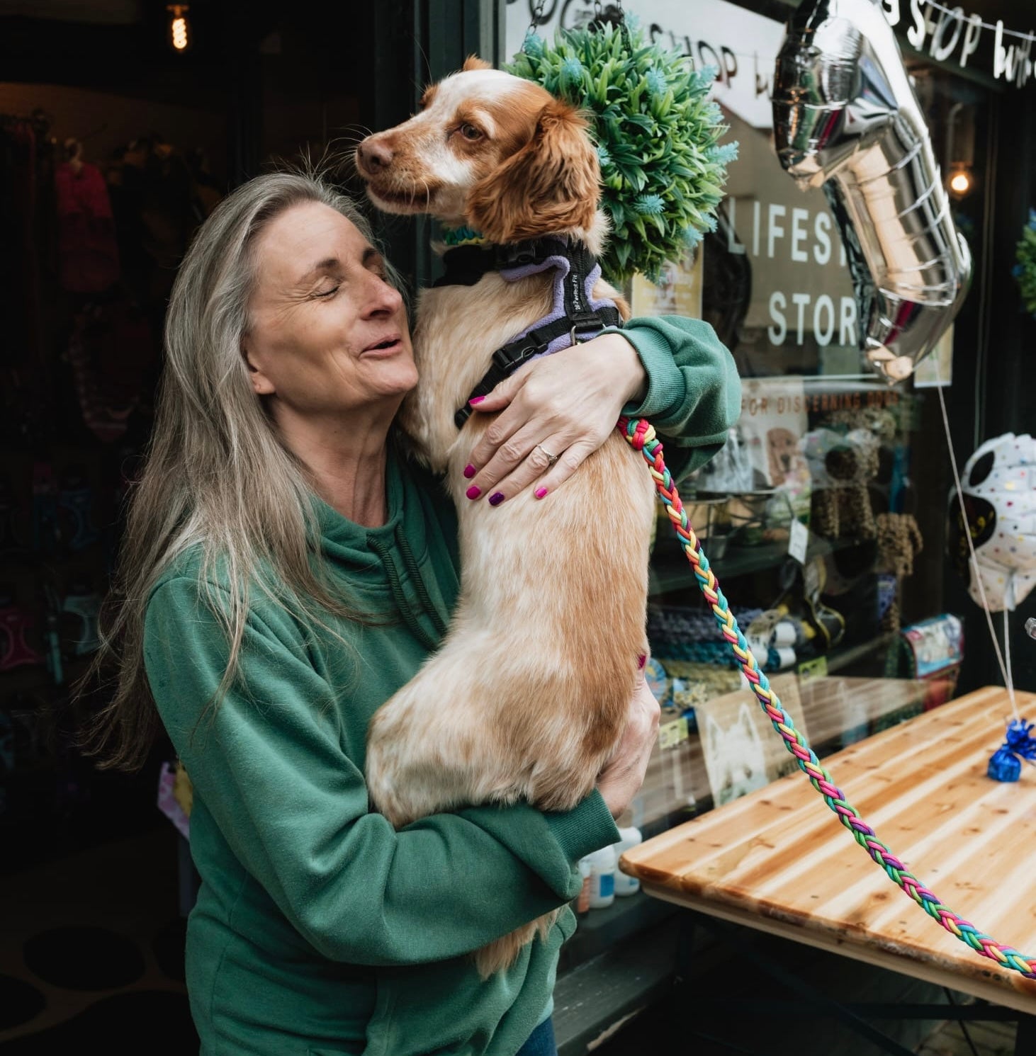Dogg Shop owner with excited dog